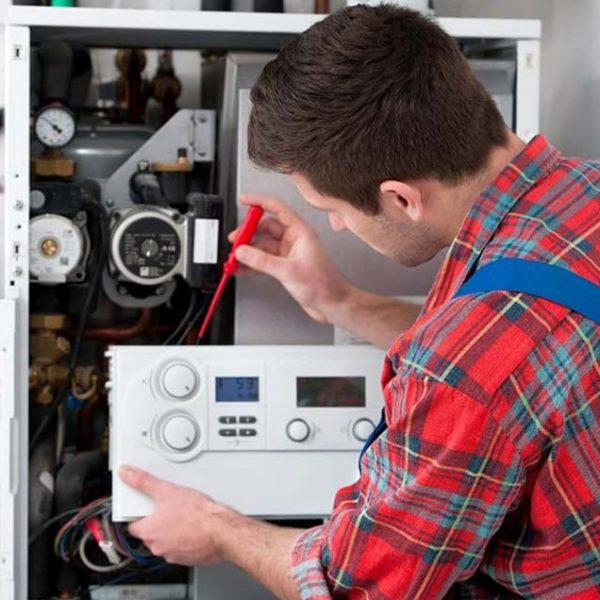 Technician servicing the gas boiler — Hot Water Systems in Buderim, QLD