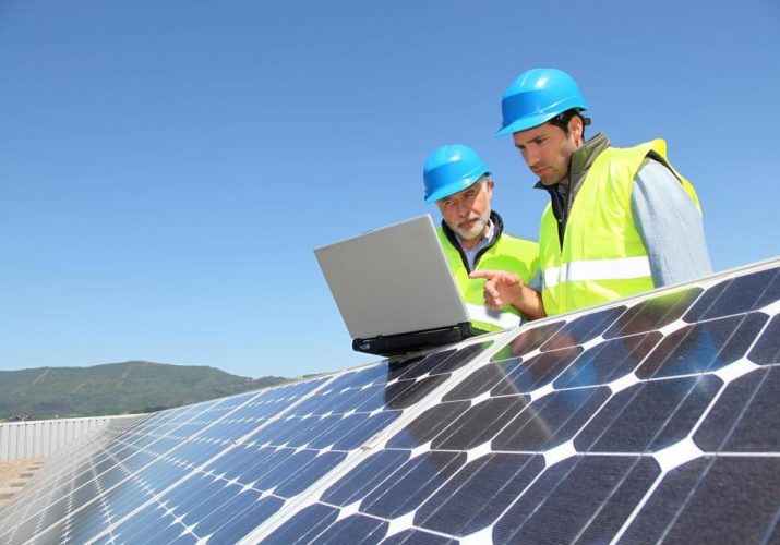 Men Checking Solar Panels
